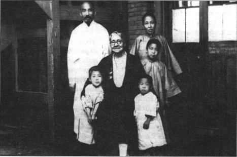 Mrs. Goforth with Pastor Su and family, Szeping Kai, Manchuria.